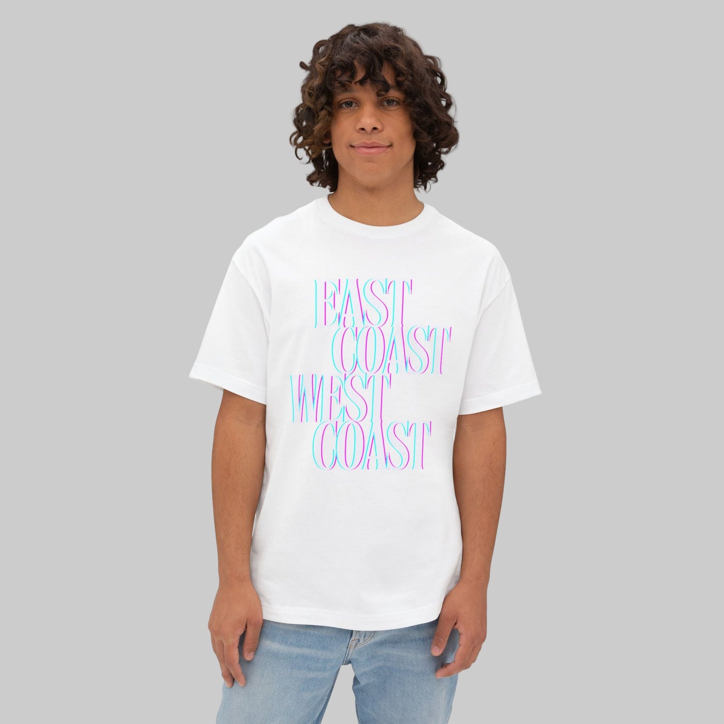 Person wearing a white t-shirt with colorful text on a white background