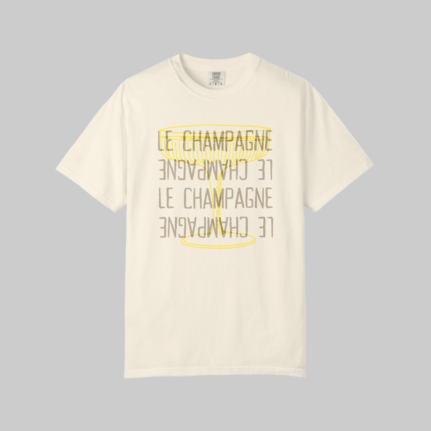 Beige t-shirt with yellow text and anchor design on a white background