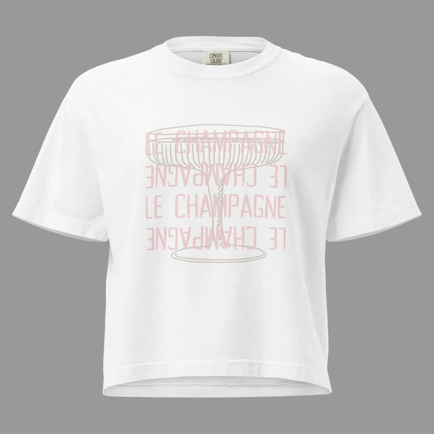 White Mid weight boxy cropped Tee with a Champagne Coup glass and Le Champagne mirrored down the front 4 times in Pink
